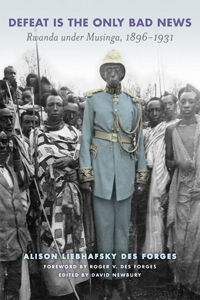 The cover of this book is a colorized photo of a group of Rwandans clustered around the extremely tall Musinga.